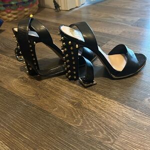 gold and black heels